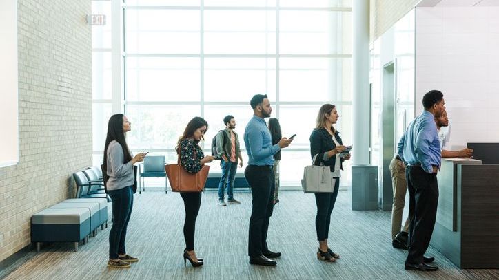 Customers wait in line at a regional bank.
