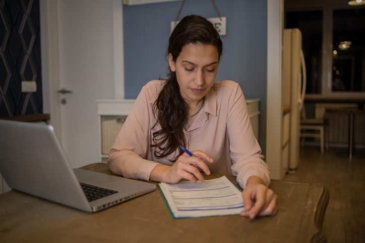 A Millennial reviewing her retirement savings plan.
