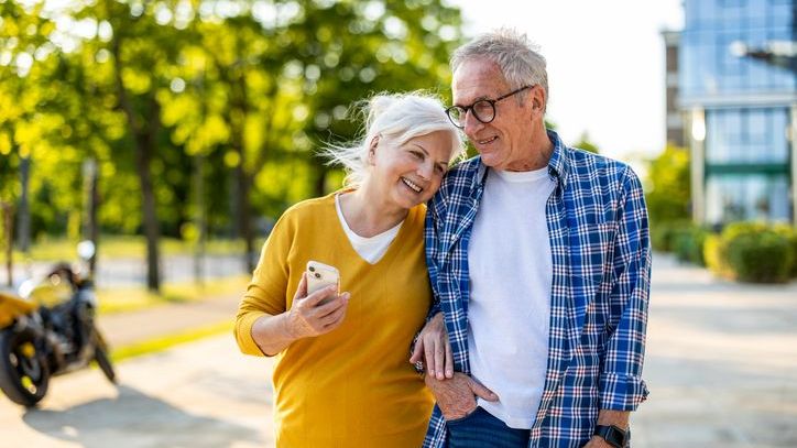 A retired couple who get some of their income from an annuity enjoy an afternoon walk together.
