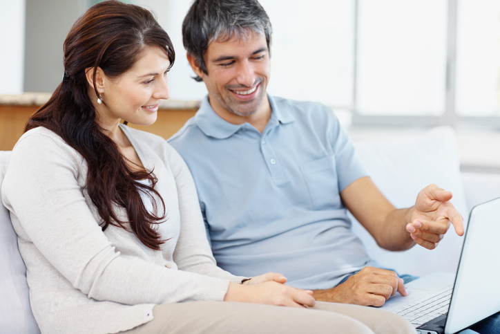 A couple comparing different strategies to help them achieve long-term investment success.