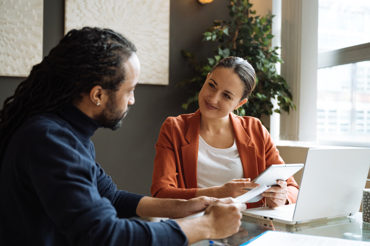 Financial advisors reviewing client referral gifts.