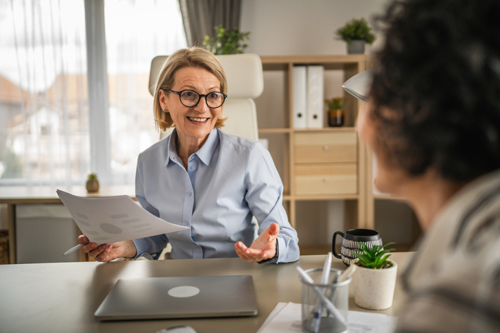 A financial advisor breaking down different types of advisor fees for a client.