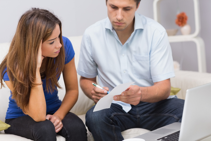 A couple adjusting their portfolio with the aim of maximizing long-term investment success.