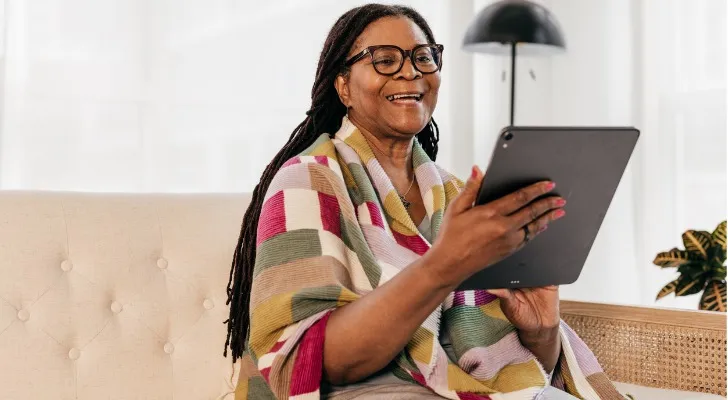 A woman looks over the financial plan that her advisor built for her.