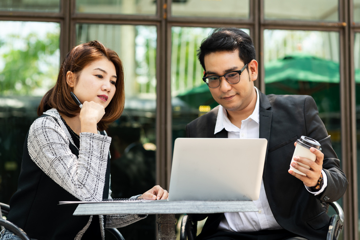 A couple using a robo-advisor to manage their investments.