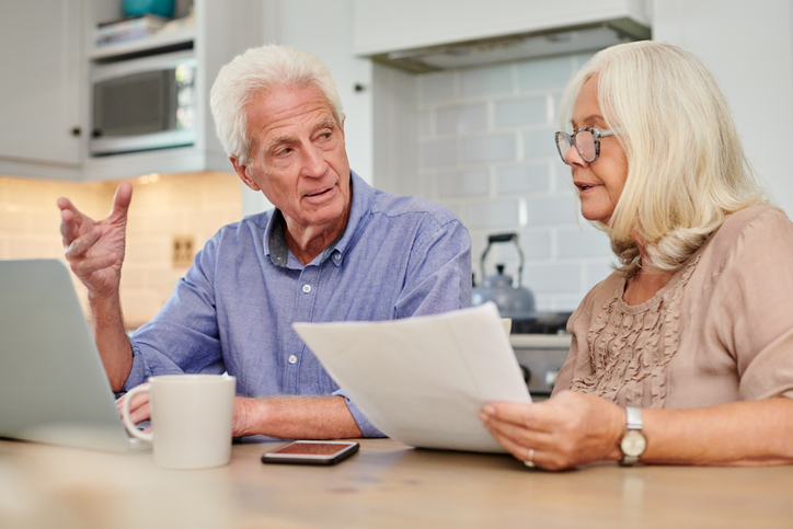 A senior couple discussing how much probate costs in Washington.