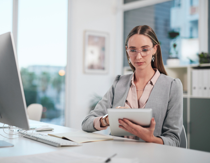 A woman making changes to her goals-based financial plan.