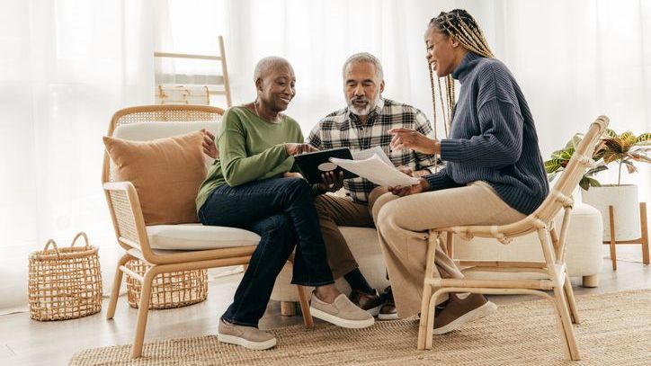 A couple reviews their estate plan with their daughter.