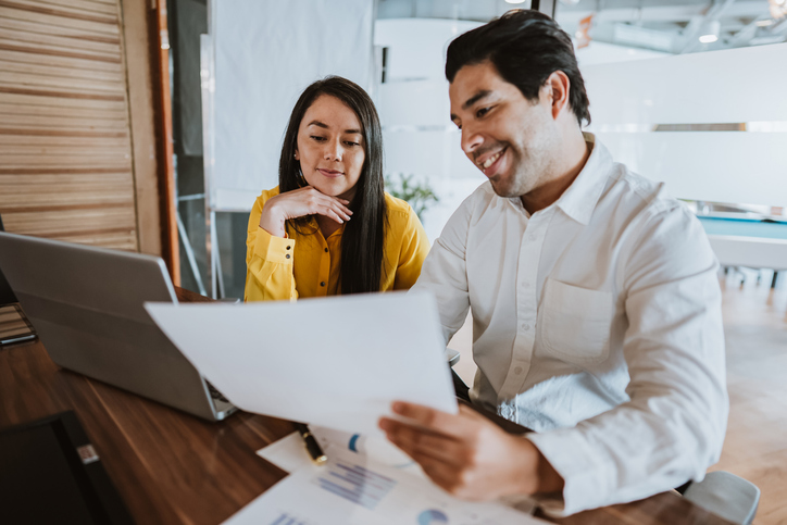 A couple deciding on a real estate investment.