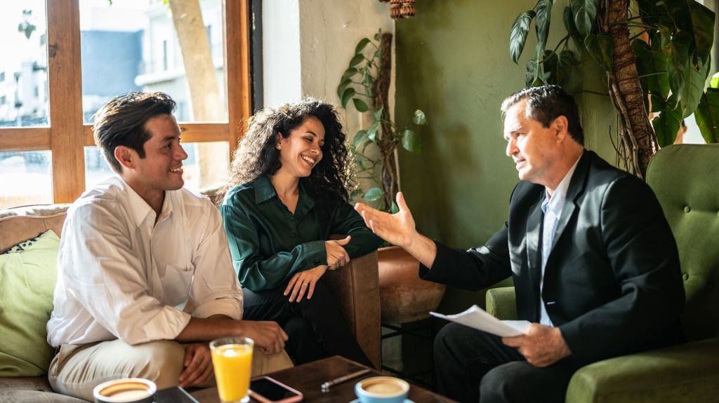 A financial advisor meets with a pair of wealthy clients to discuss their desire to contribute to a donor-advised fund.