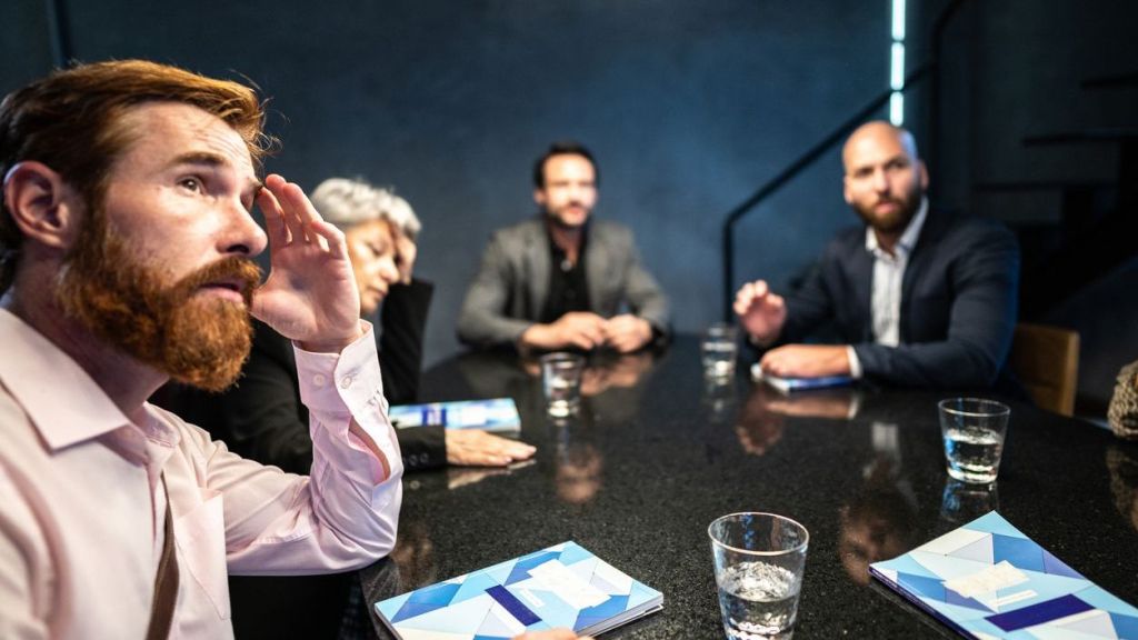 Executives of a company discuss the business declaring bankruptcy.