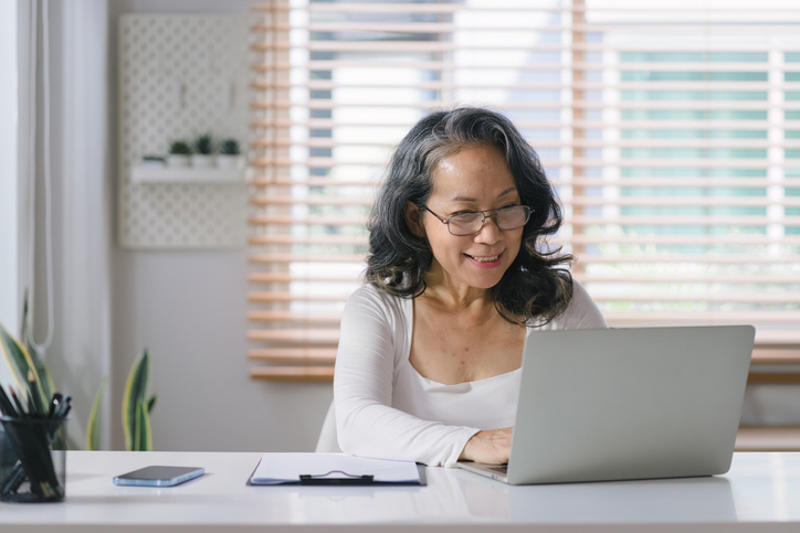A woman researching bond duration vs. maturity and choosing an appropriate bond for her portfolio.