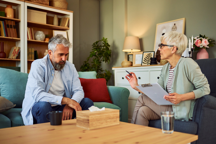 A senior couple reviewing the requirements to set up a power of attorney in Alabama.