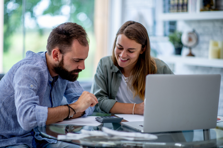 A husband and wife determining how much money they should have saved by age 45.