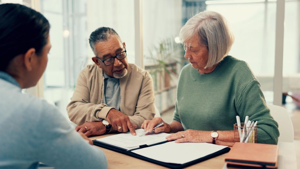 A wealthy couple meets with their financial advisor to finalize their contributions to a donor-advised fund.