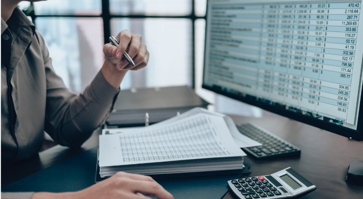 A financial advisor reviews data on a spreadsheet to calculate the cost of equity for a company.