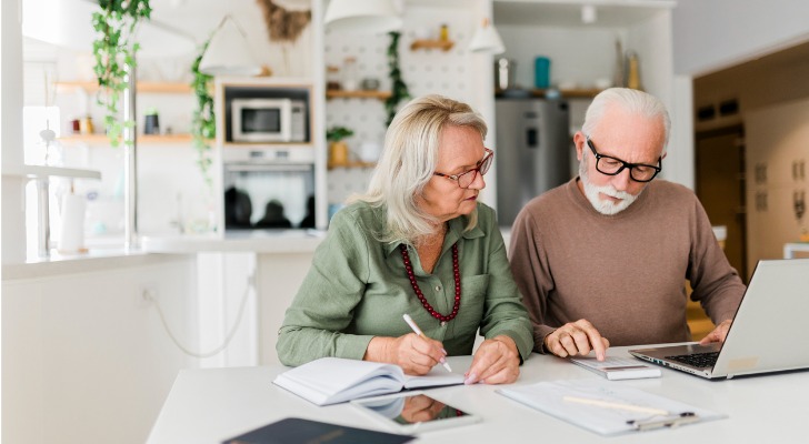 A couple looks over their finances to determine how they can reduce the taxes they pay on their Social Security.