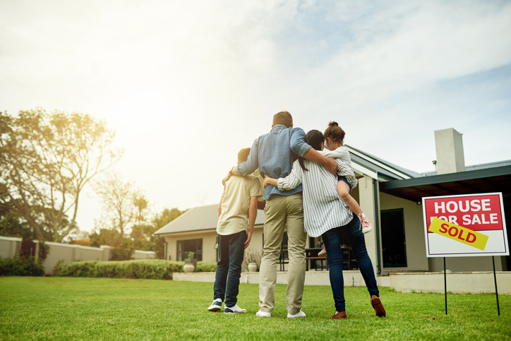 A family moving in after closing on their new home.