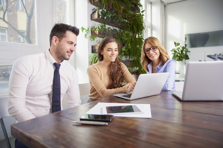 Clients meeting with an advisor to discuss powers of attorney in Maine.