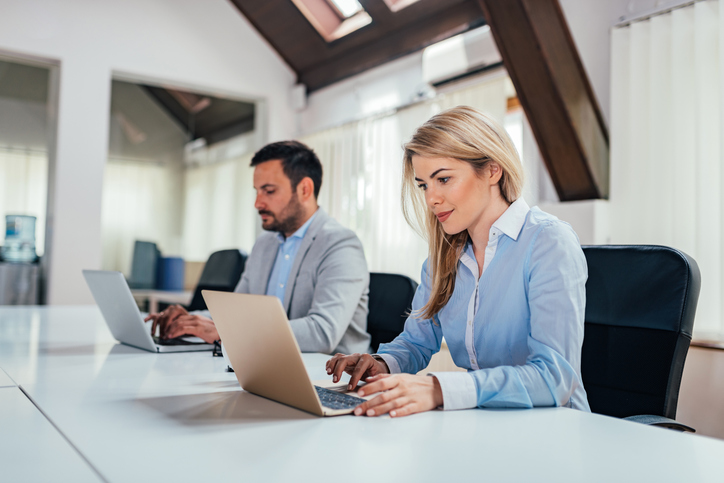 Financial advisors reviewing the portfolios of their clients.
