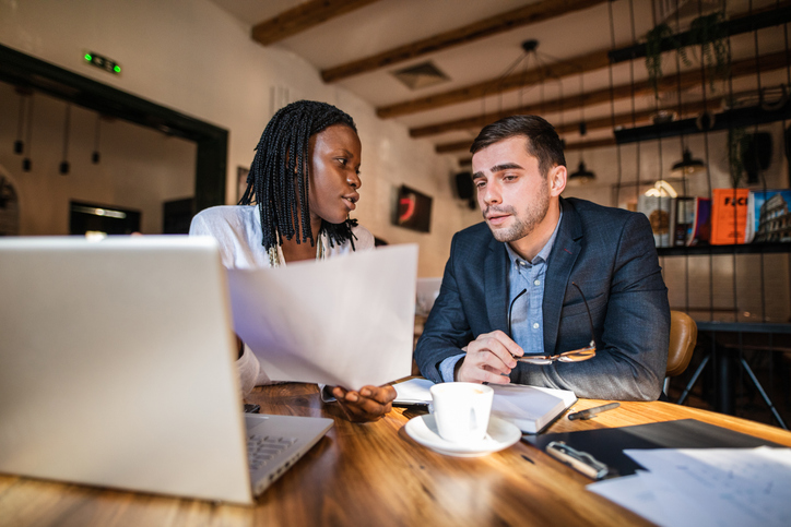 A financial advisor explaining private equity investments to a client.