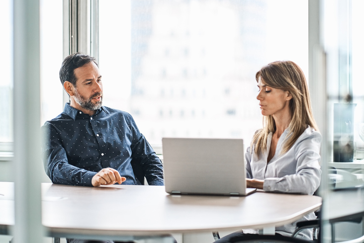 A woman meeting with a personal financial advisor.