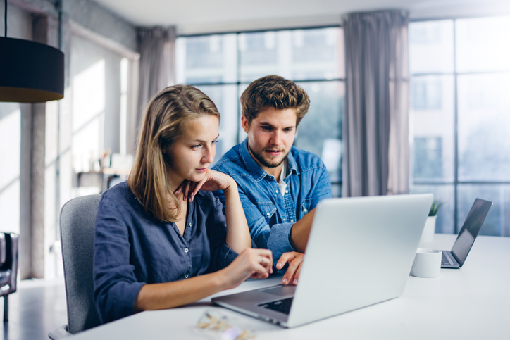 A couple implementing investment management steps to maximize the success of their portfolio.