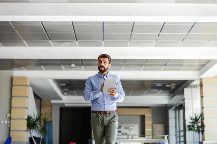 An investor touring a potential commercial real estate investment.