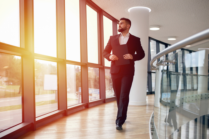 An investor inspecting the commercial real estate property that he just bought.