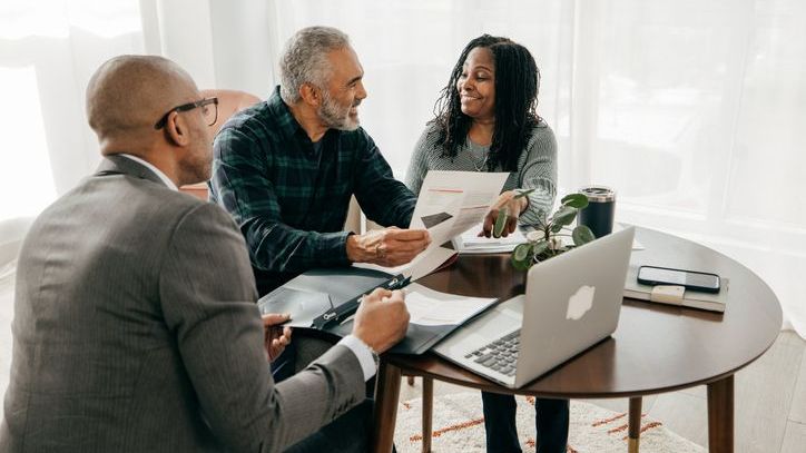 A brother and sister meet with a probate attorney whom they've hired to help administer their father's estate.