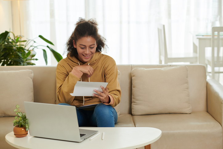 A college applicant reading her financial aid letter.