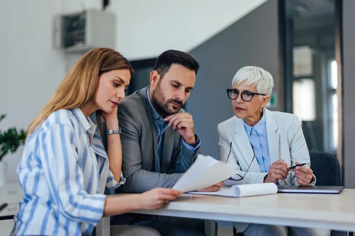 Clients meeting with a financial advisor to create an estate plan.