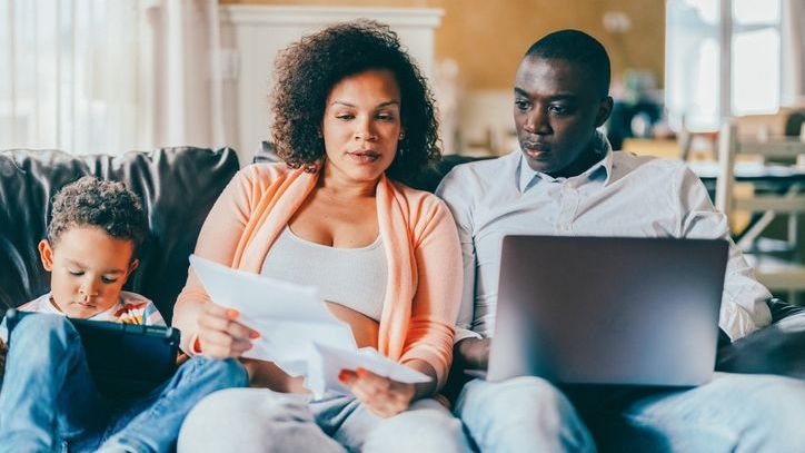 A couple reviews 529 plan options for their son.