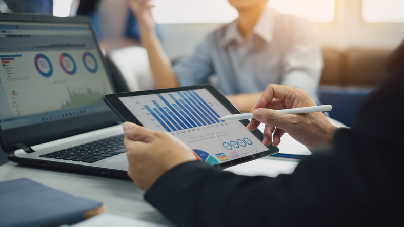 An investor reviews their portfolio via digital wealth management.