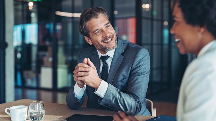 A wealth manager meets with a client to discuss her portfolio.