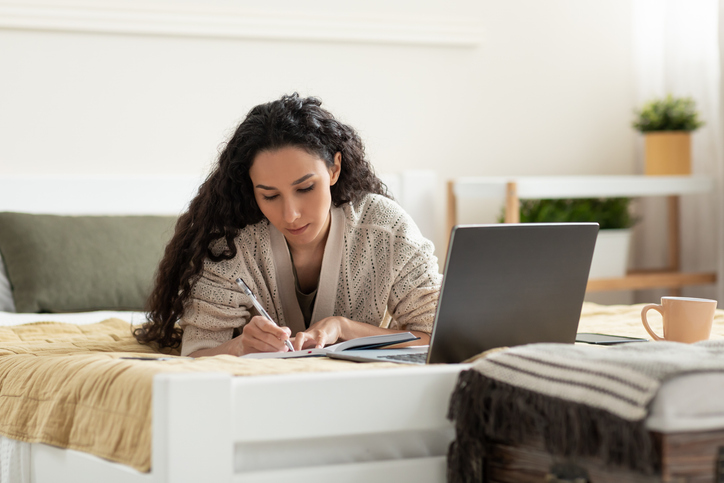 A woman researching ways to borrow money to invest in the market.