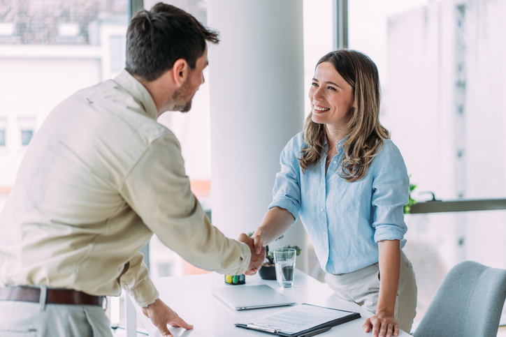 An investor meeting a real estate broker to discuss a potential investment.