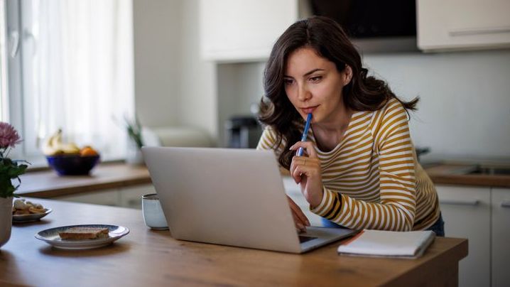 A woman looks over the different types of certificates of deposit (CDs) that are available.