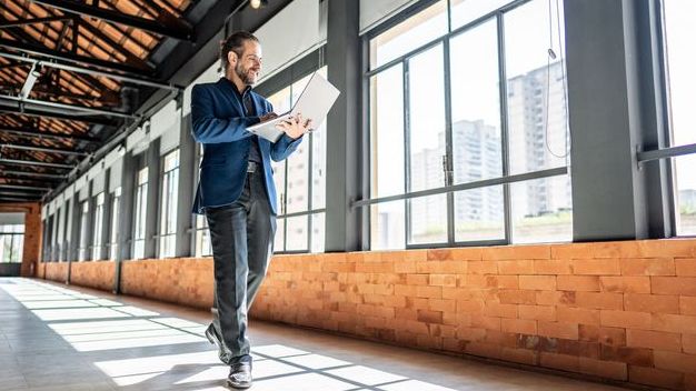 A real estate investor tours a commercial building that he's considering investing in.