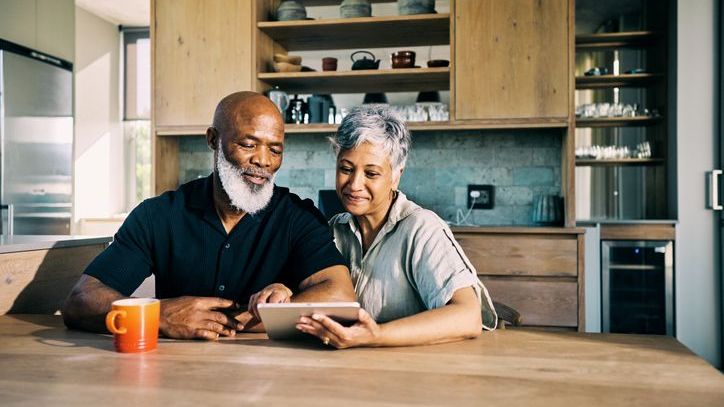 A couple looks over the progress they've made toward their long-term goal of retiring abroad.