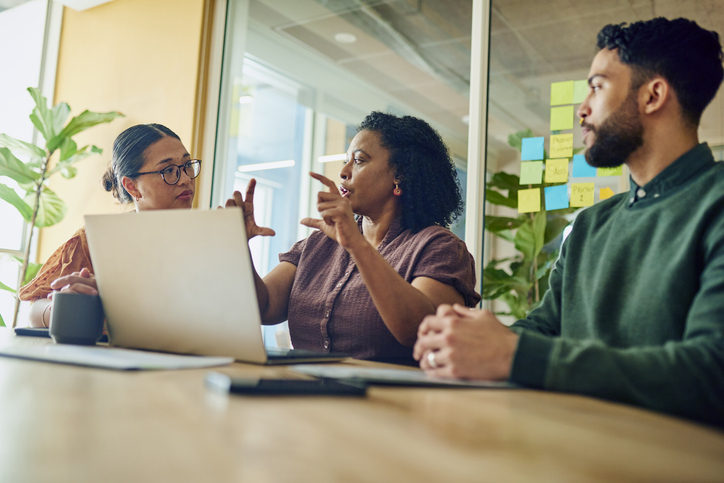 Clients meeting with an advisor to discuss private equity investments.