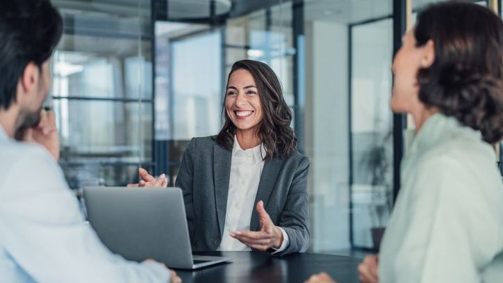 A financial advisor meets with clients to discuss their investment portfolio.