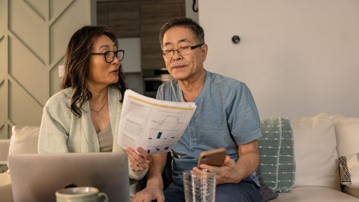 A couple goes over their finances as they get ready to sell their family business and retire.