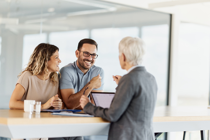A couple meeting with a personal financial advisor.