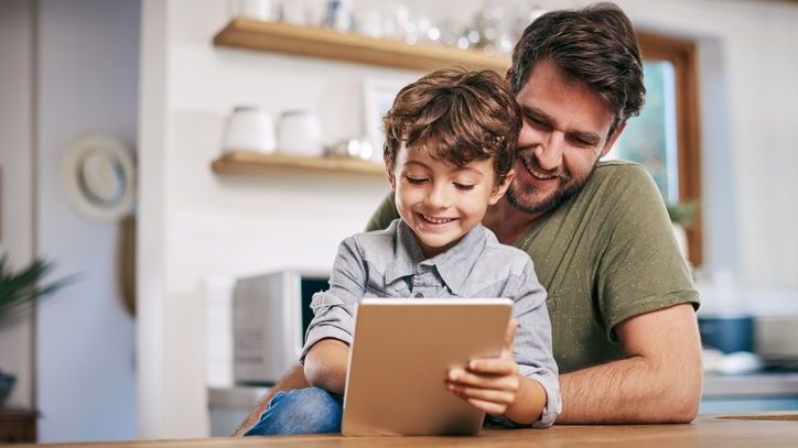 A father explains to his young son how he's using a 529 plan to save for his college education.