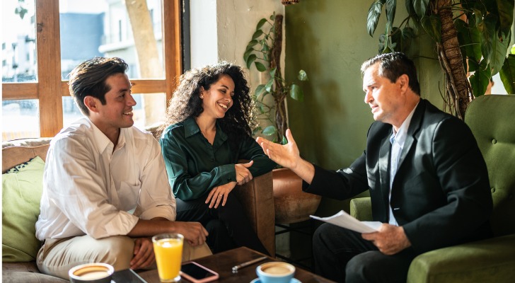 A couple meets with their financial advisor to discuss their financial plan.