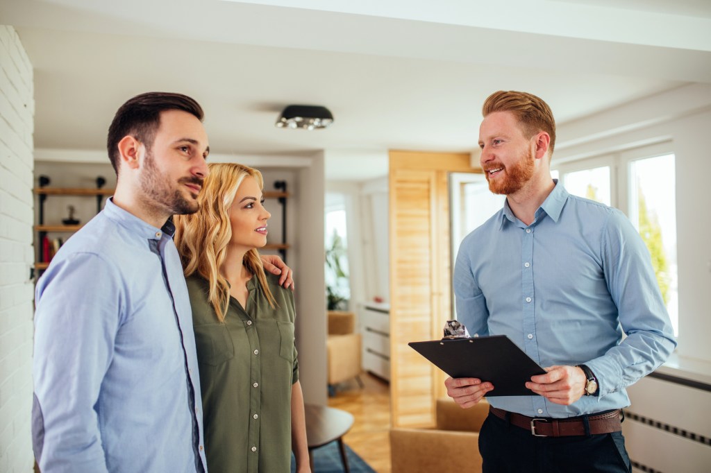A property manager meeting with new tenants.
