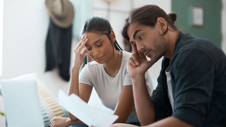 A woman tells her partner about debt that she previously kept hidden from him.