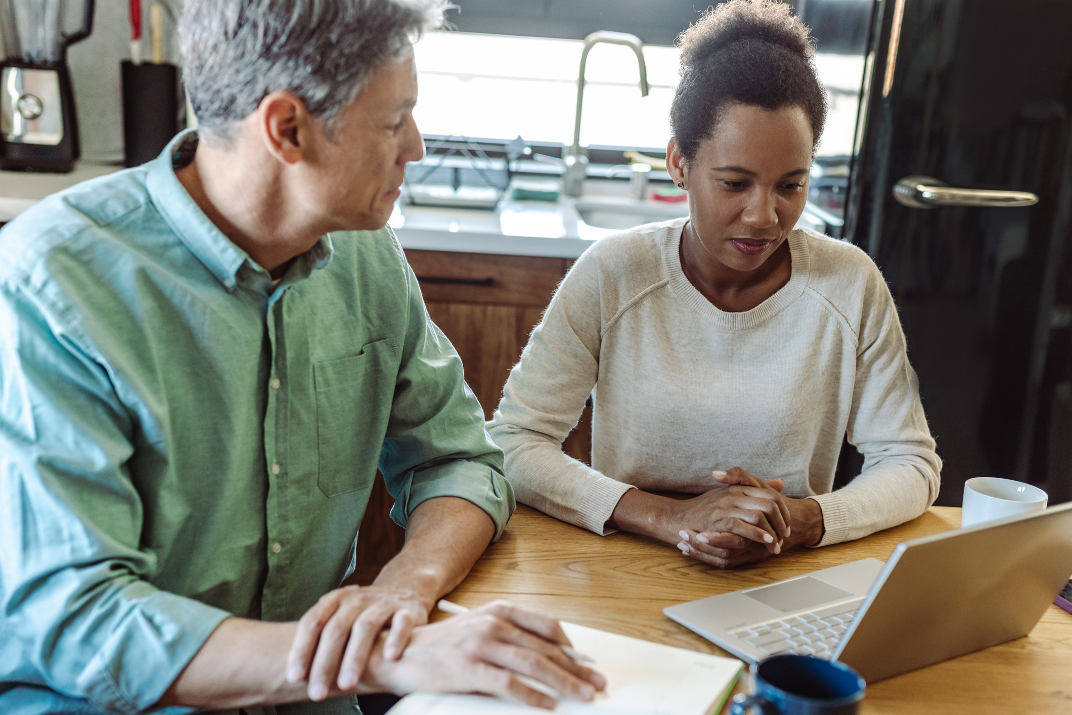 A couple looking up how to deduct mortgage interest on rental properties.