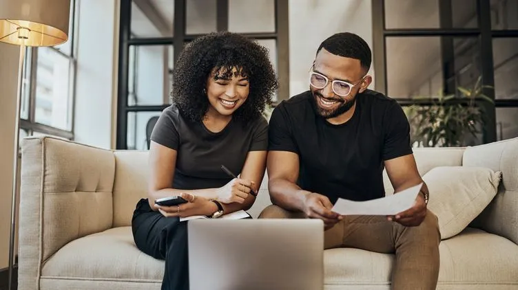 A couple is happy to see how their investment portfolio has grown over time thanks in part to the power of compound interest.